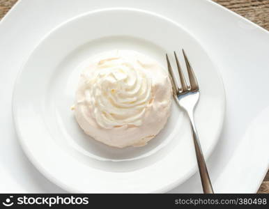 Meringue cake with whipped cream and berry topping