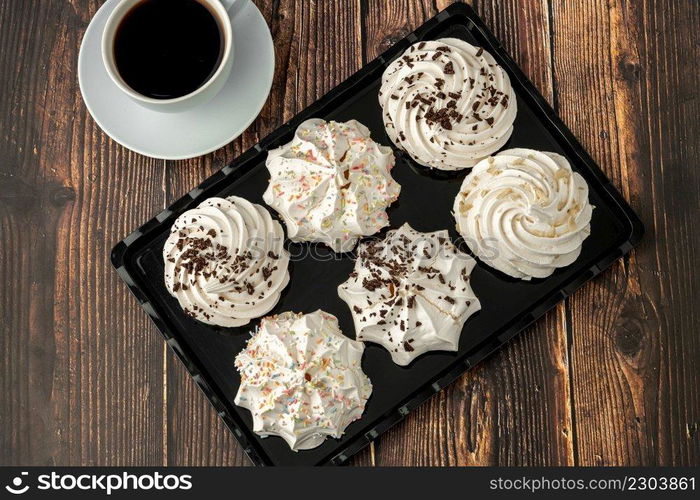 meringue cookies or beze cookies with candy and chocolate