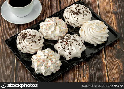 meringue cookies or beze cookies with candy and chocolate