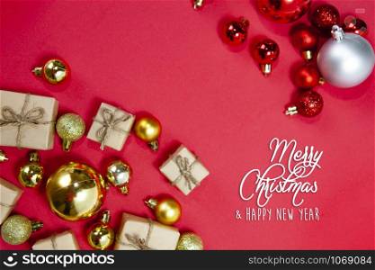 Merry Christmas and happy holidays xmas gifts. Baubles, presents, candy with christmas ornaments. Top view. Christmas family traditions on red background