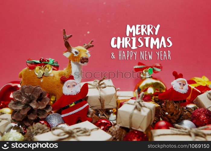 Merry Christmas and happy holidays xmas gifts. Baubles, presents, candy with christmas ornaments. Top view. Christmas family traditions on red background