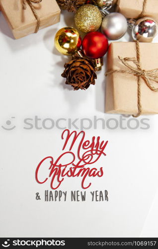 Merry Christmas and happy holidays xmas gifts. Baubles, presents, candy with christmas ornaments. Top view. Christmas family traditions on white background