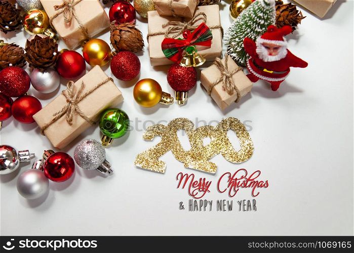 Merry Christmas and happy new year 2020 xmas gifts. Baubles, presents, candy with christmas ornaments. Top view. Christmas family traditions on white background