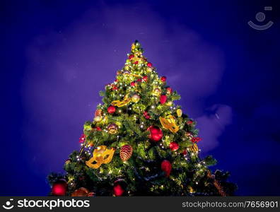 Merry Christmas and happy New Year background.Christmas tree with decorations.