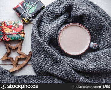 Merry Christmas and Happy New Year. Beautiful card, Christmas decorations and a cup of hot cocoa. View from above, close-up. Congratulations to loved ones, family, relatives, friends and colleagues. Merry Christmas and Happy New Year. Beautiful card