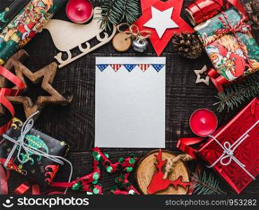Merry Christmas and Happy New Year. Beautiful card with American flag pattern. View from above, close-up, flat lay. Congratulations to loved ones, family, relatives, friends and colleagues. Merry Christmas and Happy New Year. Flat lay.
