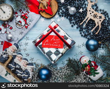 Merry Christmas and Happy New Year. Beautiful card with Christmas decorations. View from above, close-up, flat lay. Congratulations to loved ones, family, relatives, friends and colleagues. Merry Christmas and Happy New Year. Beautiful card