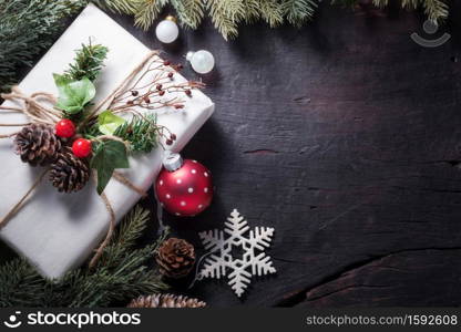 Merry Christmas and Happy New Year decoration for celebration on black wood background with copy space.