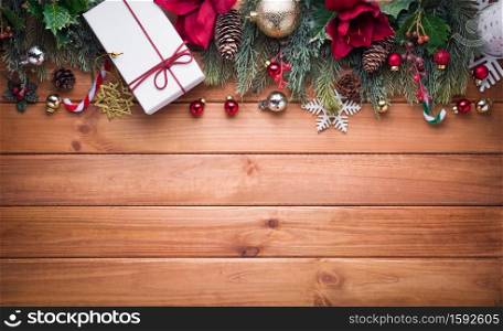 Merry Christmas and Happy New Year decoration for celebration on brown wood background with copy space.