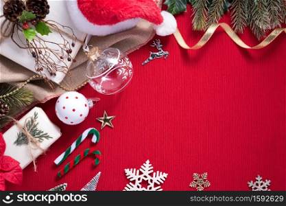 Merry Christmas and Happy New Year decoration for celebration on red cloth background with copy space.