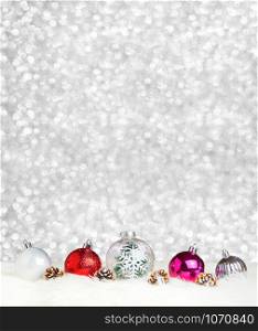 Merry Christmas decoration ball on white fur at silver bokeh light background,Banner vertical Holiday greeting card.