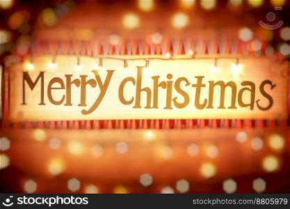 Merry Christmas greeting card, abstract glowing orange background with bokeh, door decorated with festive garland, happy winter holiday