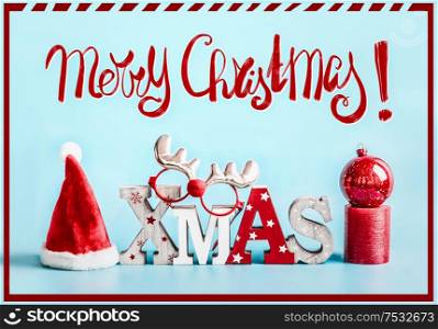 Merry Christmas greeting card with holiday decoration on blue background. Festive Xmas concept.