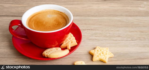 Merry Christmas with homemade cookies and coffee cup on wood table background. Xmas eve, party, holiday and happy New Year concept