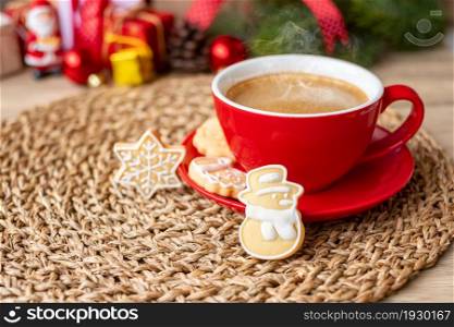 Merry Christmas with homemade cookies and coffee cup on wood table background. Xmas eve, party, holiday and happy New Year concept