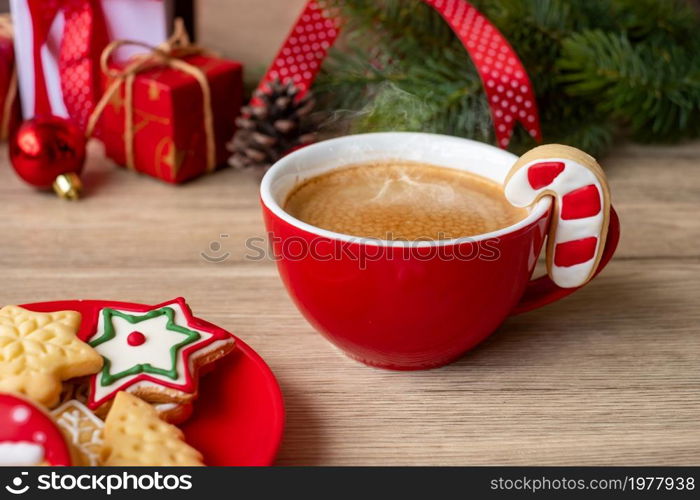 Merry Christmas with homemade cookies and coffee cup on wood table background. Xmas eve, party, holiday and happy New Year concept