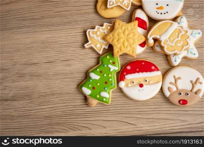 Merry Christmas with homemade cookies on wood table background. Xmas, party, holiday and happy New Year concept