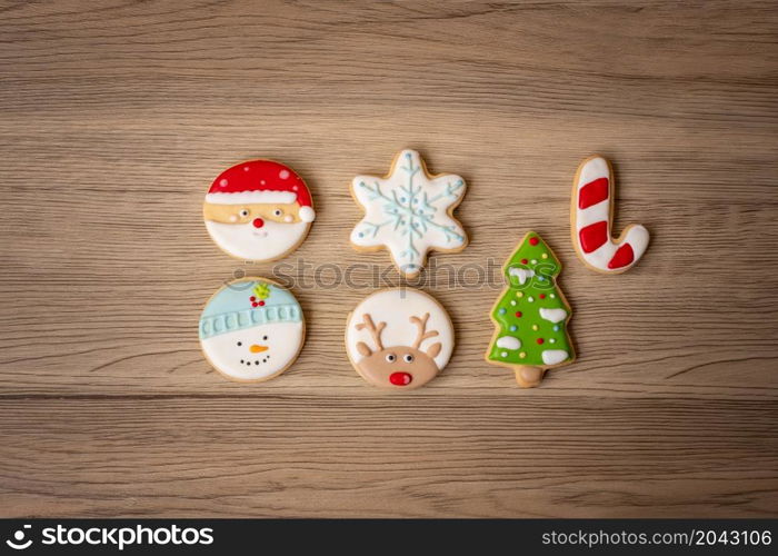 Merry Christmas with homemade cookies on wood table background. Xmas, party, holiday and happy New Year concept