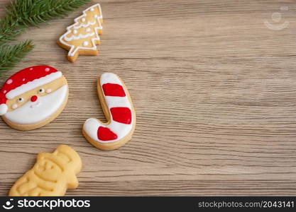 Merry Christmas with homemade cookies on wood table background. Xmas, party, holiday and happy New Year concept