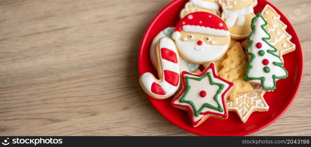 Merry Christmas with homemade cookies on wood table background. Xmas, party, holiday and happy New Year concept