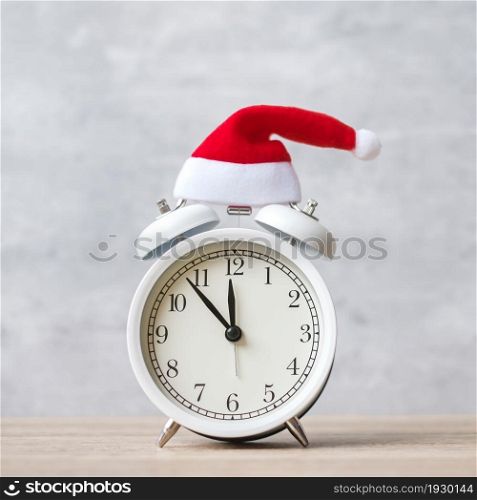 Merry Christmas with Vintage alarm clock and Xmas decoration on wooden table. party, holiday and boxing day concept