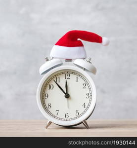 Merry Christmas with Vintage alarm clock and Xmas decoration on wooden table. party, holiday and boxing day concept