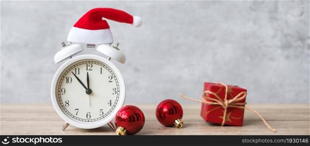 Merry Christmas with Vintage alarm clock and Xmas decoration on wooden table. party, holiday and boxing day concept