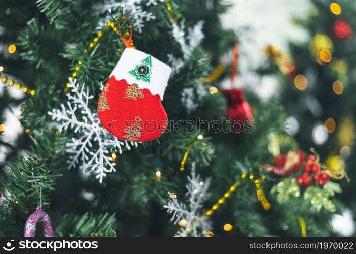 Merry x-mas,Close up of Colorful balls ,gifts box and Christmas greeting picture parcel decoration on Green Christmas tree background Decoration During Christmas and New Year.