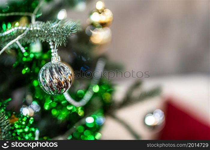 Merry x-mas,Close up of Colorful balls ,gifts box and Christmas greeting picture parcel decoration on Green Christmas tree background Decoration During Christmas and New Year.