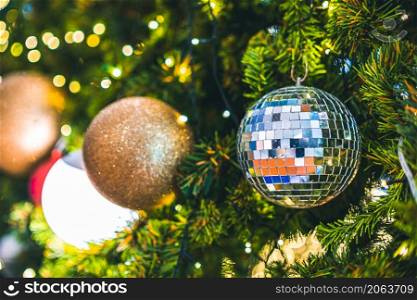 Merry x-mas,Close up of Colorful balls ,gifts box and Christmas greeting picture parcel decoration on Green Christmas tree background Decoration During Christmas and New Year.