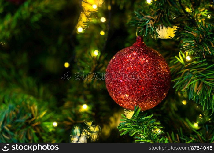 Merry x-mas,Close up of Colorful balls ,gifts box and Christmas greeting picture parcel decoration on Green Christmas tree background Decoration During Christmas and New Year.