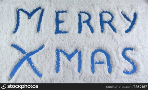 Merry Xmas drawn on snow background with matte