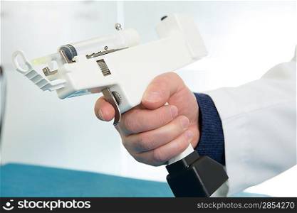 mesotherapy gun electronic with syringe on doctor hands