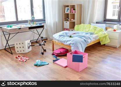 mess, disorder and interior concept - view of messy home kid&rsquo;s room with scattered stuff. messy home or kid&rsquo;s room with scattered stuff