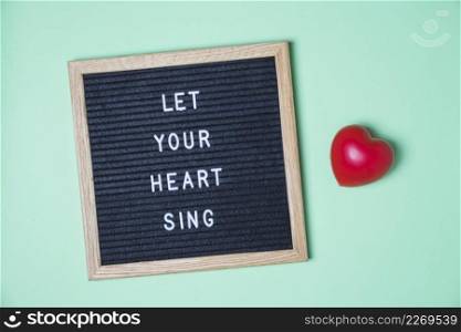 message board red heart turquoise background