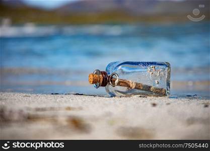 Message in the bottle against the Sun setting down
