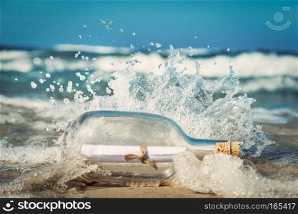 Message in the bottle coming with wave from ocean. Concept of travel, romantic secret, marine. Message in the bottle coming with wave from ocean