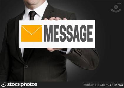message sign is held by businessman. message sign is held by businessman.