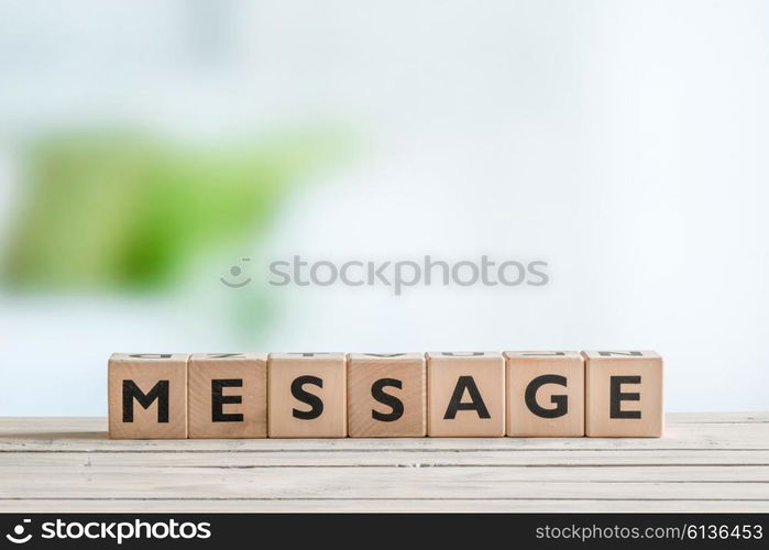 Message word made with alphabet cubes on a table