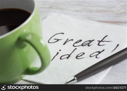 Message written on napkin. Message written on napkin and cup of coffee on wooden table