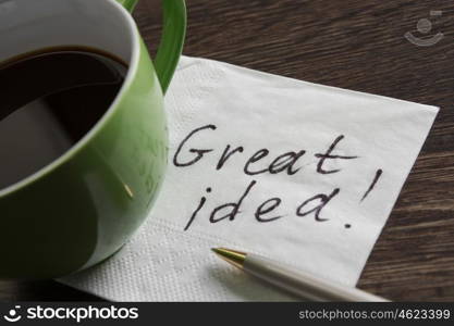 Message written on napkin. Message written on napkin and cup of coffee on wooden table