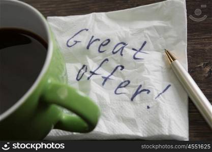 Message written on napkin. Words written on napkin and cup of coffee on wooden table