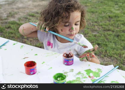 messy girl painting canvas park