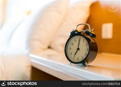 Metal Alarm clock on white bedroom