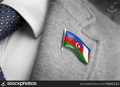 Metal badge with the flag of Azerbaijan on a suit lapel.. Metal badge with the flag of Azerbaijan on a suit lapel