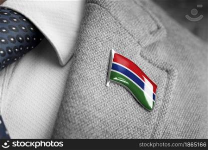 Metal badge with the flag of Gambia on a suit lapel.. Metal badge with the flag of Gambia on a suit lapel