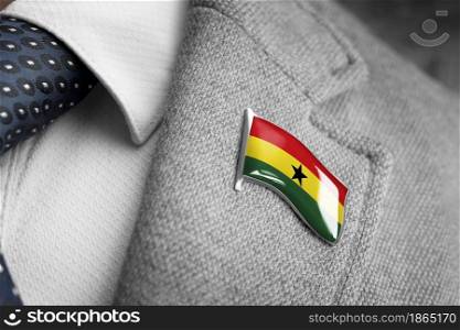 Metal badge with the flag of Ghana on a suit lapel.. Metal badge with the flag of Ghana on a suit lapel