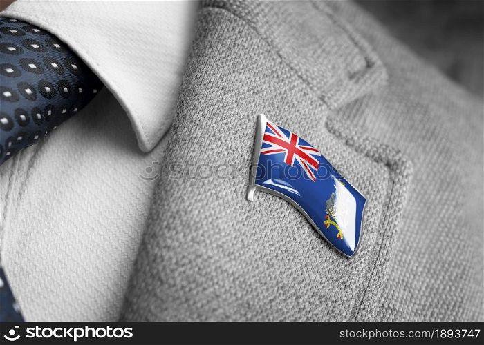 Metal badge with the flag of South Georgia and the South Sandwich Islands on a suit lapel.. Metal badge with the flag of South Georgia and the South Sandwich Islands on a suit lapel
