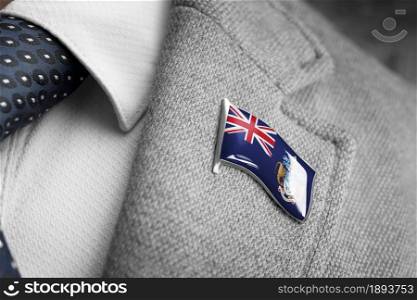 Metal badge with the flag of Tristan da Cunha on a suit lapel.. Metal badge with the flag of Tristan da Cunha on a suit lapel