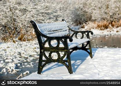 Metal bench cover with snow